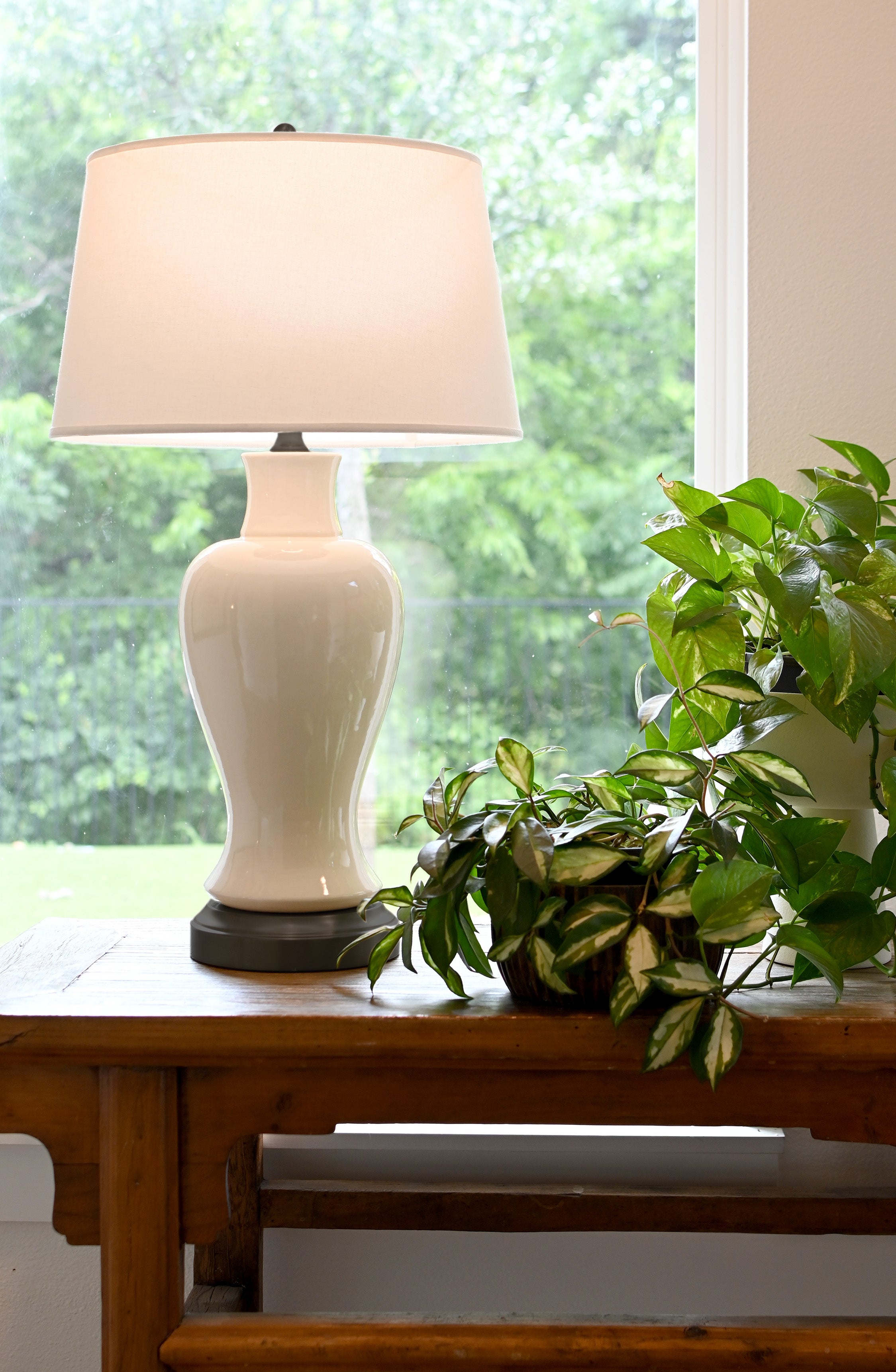 white ceramic lamp with black battery base full sized