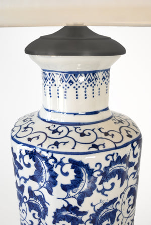 blue and white ceramic with black detail