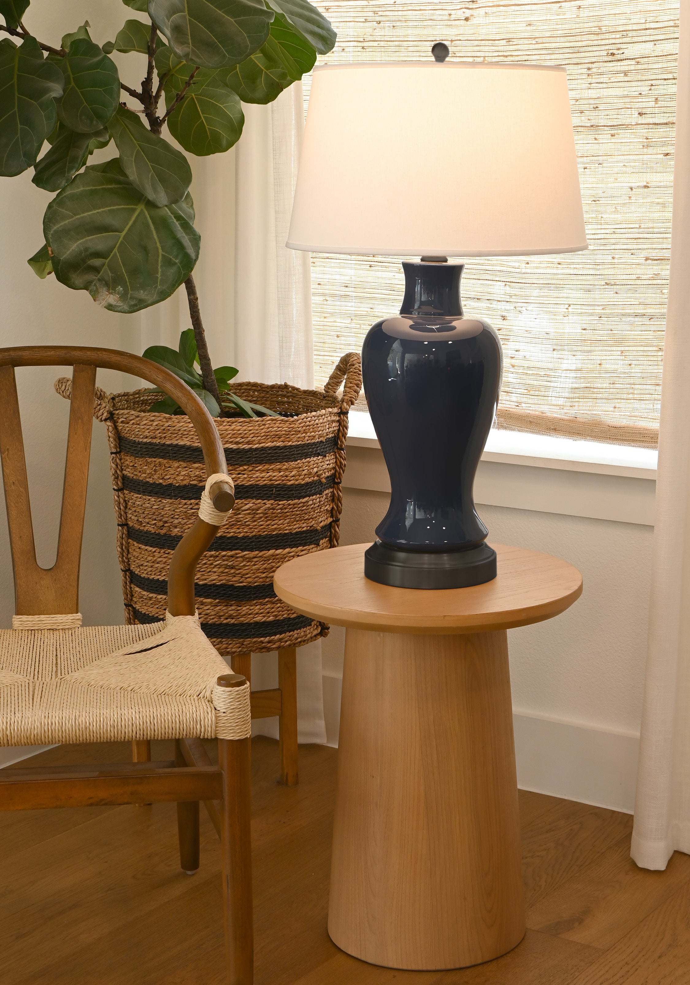 navy ceramic on black metal base holds battery for rechargeable lamp