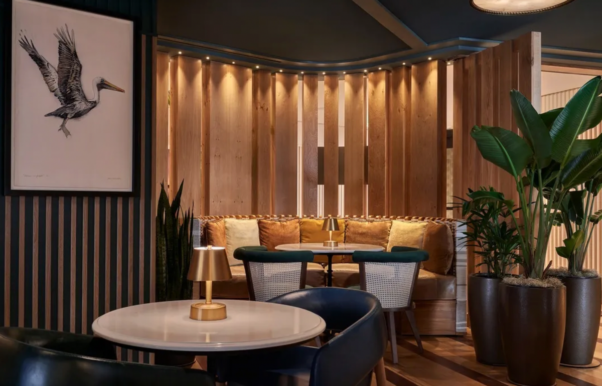 Modern Lantern Cordless Mini Lamps illuminating a cozy seating area with plants and wood accents.