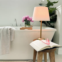 rechargeable brass mini lamp in bathroom