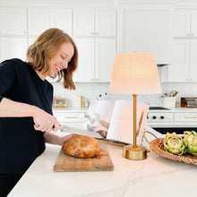 Cordless brass adjustable mini lamp in kitchen setting