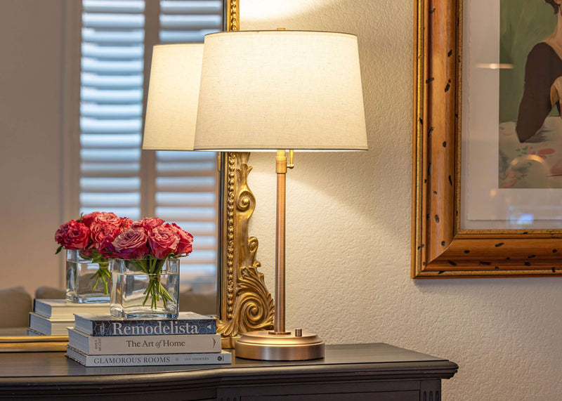 OPEN BOX Alexis Cordless Table Lamp on a table with flowers and books in a stylish living room setting.