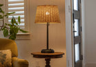 alexis black metal cordless lamp with rattan shade