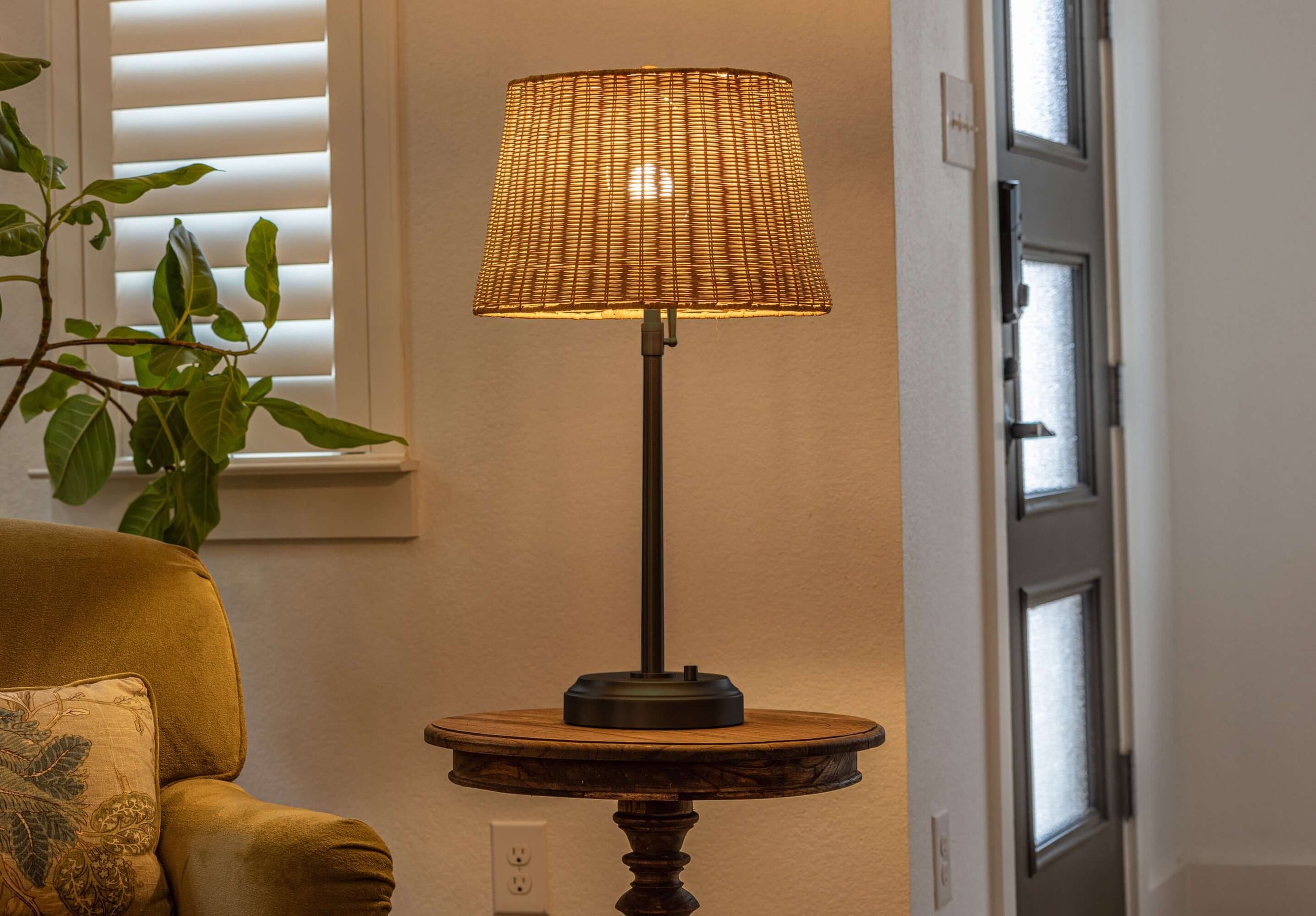 alexis black metal cordless lamp with rattan shade
