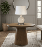 Wooden side table with abbeygale nickel cordless lamp in a entry room setting