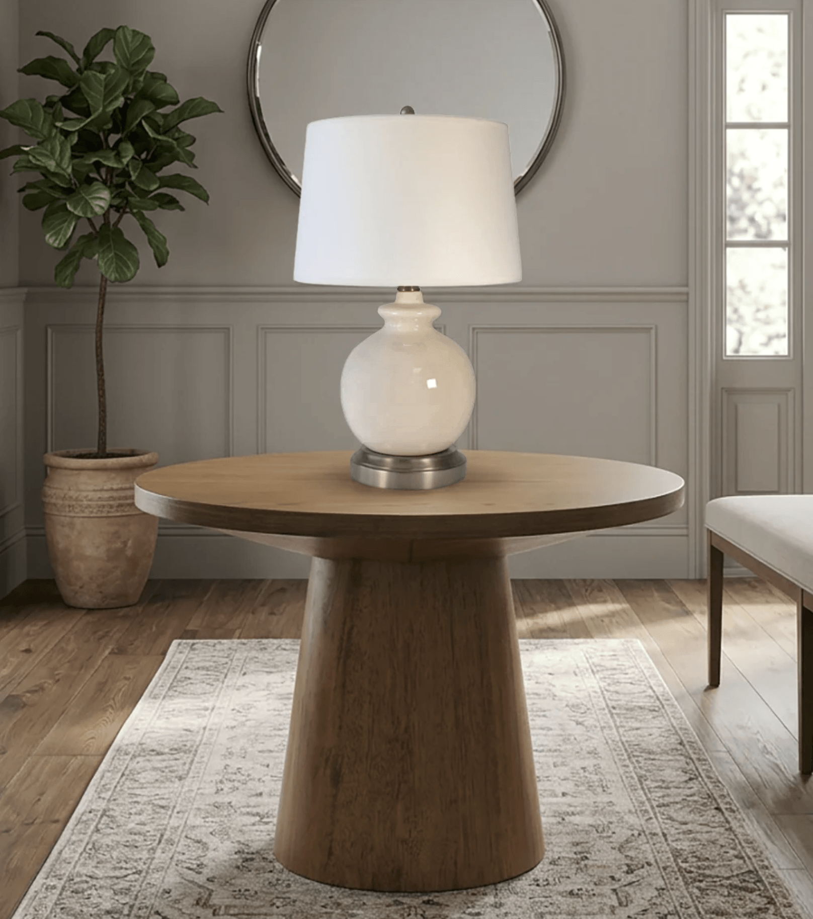 Wooden side table with abbeygale nickel cordless lamp in a entry room setting