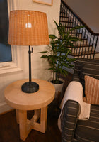 alexis black metal cordless lamp with rattan shade