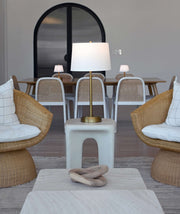 OPEN BOX Alexis Cordless Table Lamp in antique brass with linen shade illuminating a modern living space.