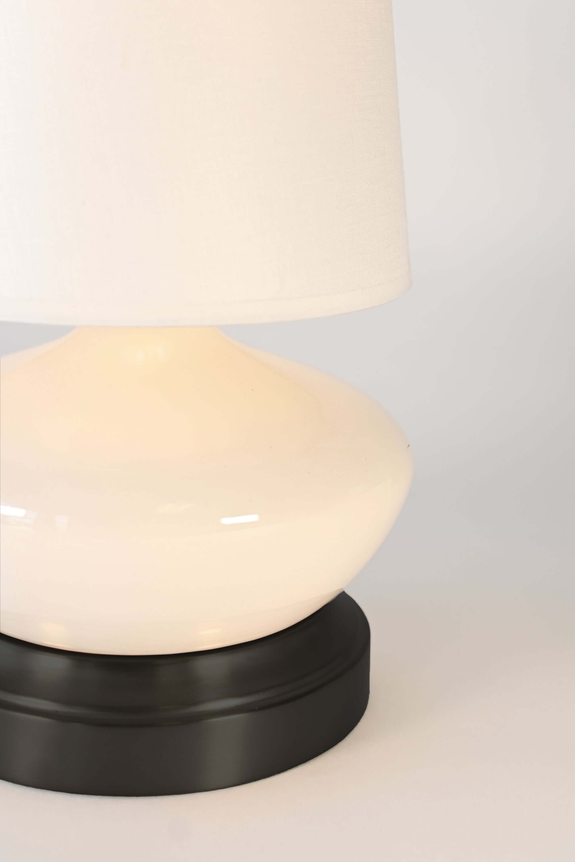 bella ivory ceramic detail on black metal base