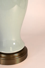 celadon glaze on dark brass base detal