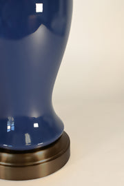 dark blue ceramic glaze on dark brass cordless lamp detail