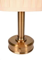 detail of modern lantern lucy mini cordless lamp with dark brass metal finish and pleated fabric shade