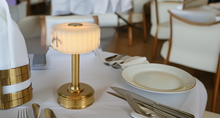 Decorative cordless table lamp on a set dining table restaurant lighting