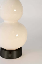 ivory ceramic detail on battery base in black metal finish
