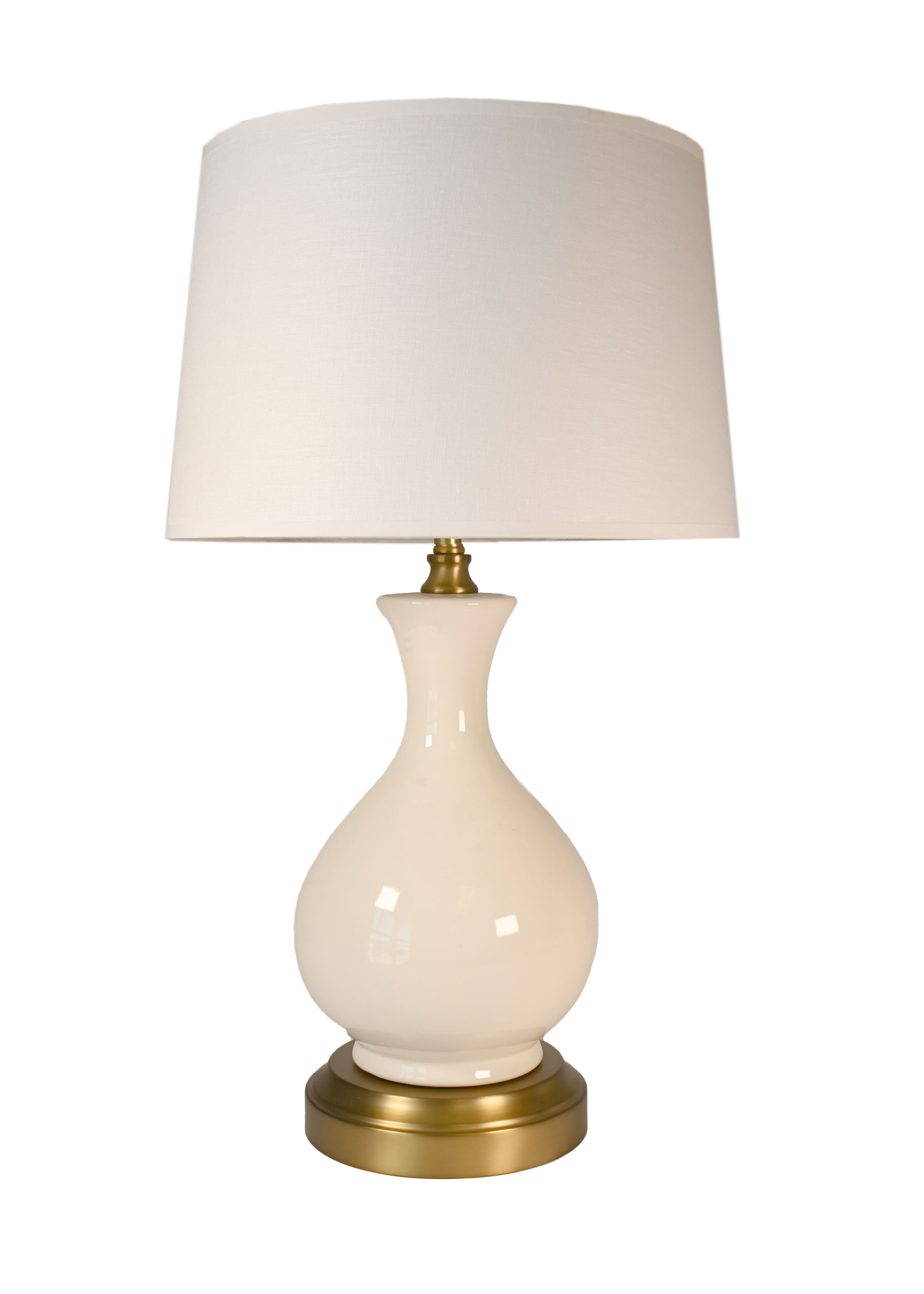 A cordless table lamp with a glossy cream-colored ceramic vase-shaped base, an off white linen shade, and a polished brass-finished metal top and circular base.