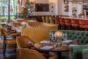Elegant dining area with plush seating and mini cordless lamp, perfect for restaurants and events.